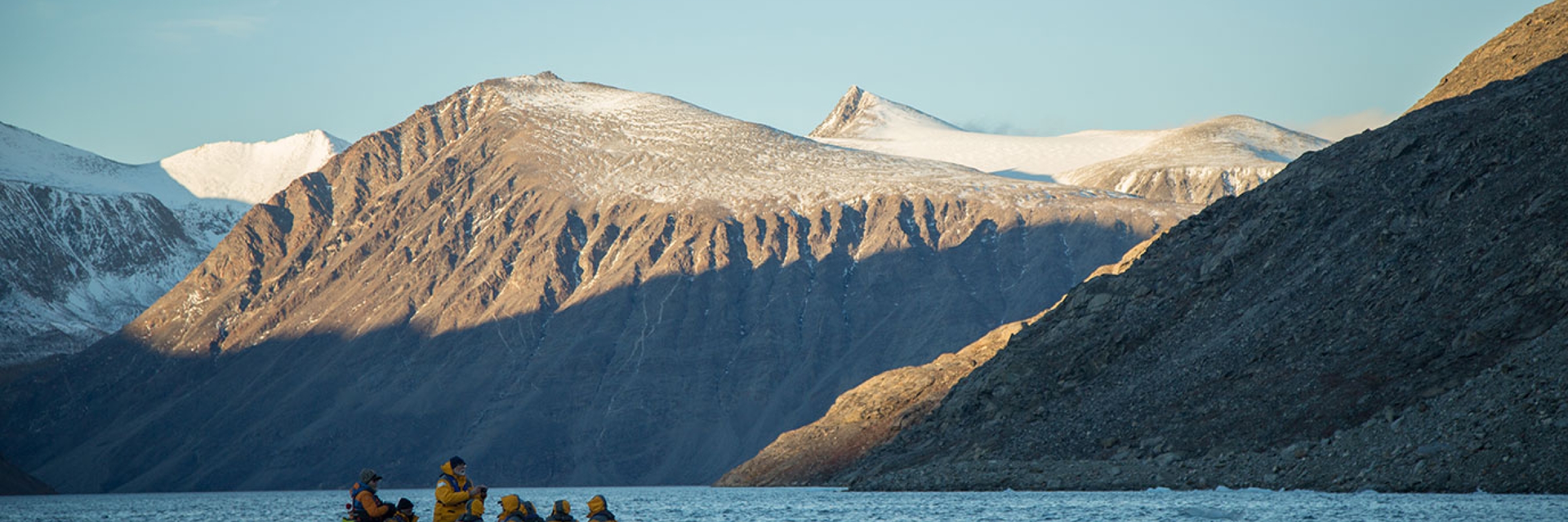 Guests Zodiac cruising Sunneshine Fjord, Baffin Island in the Canadian High Arctic - Photo by Acacia Johnson